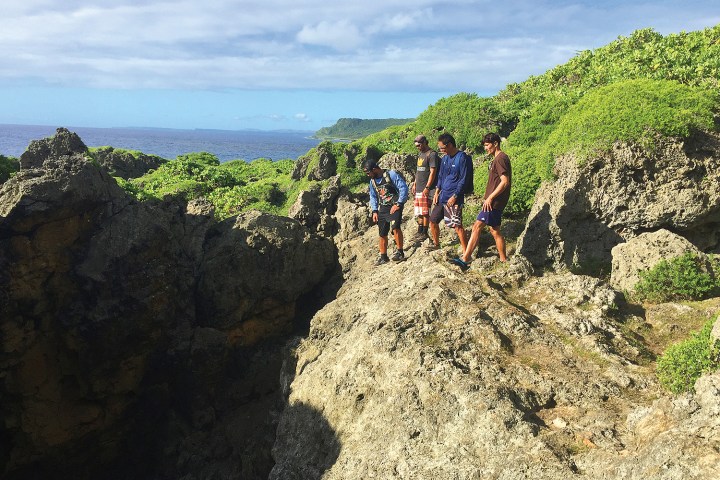 People looking over the ledge during a hike