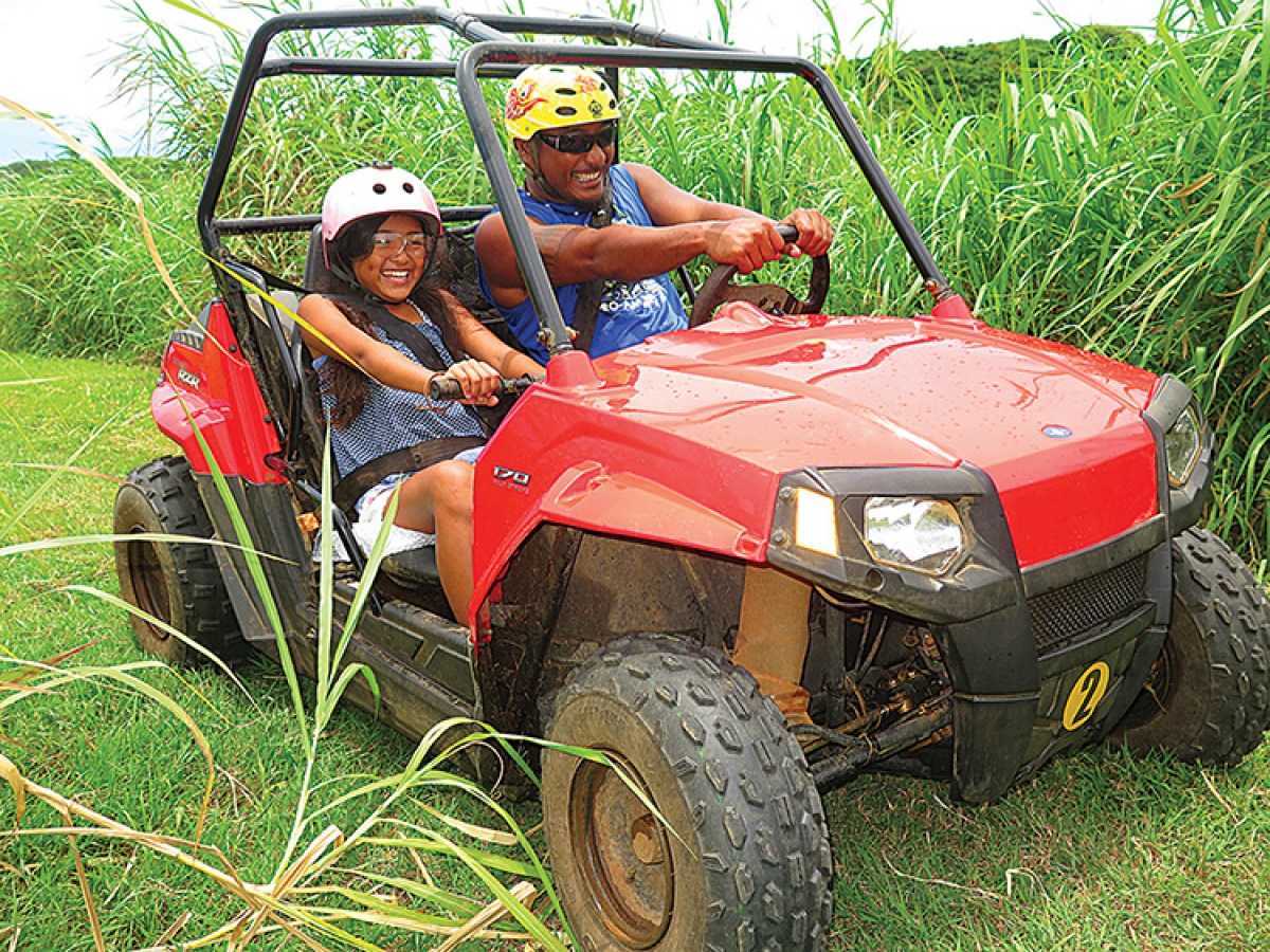 A man driving a buggy with his daughter