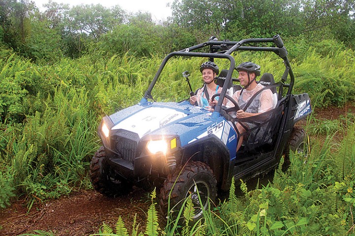 Two people in an off road buggy