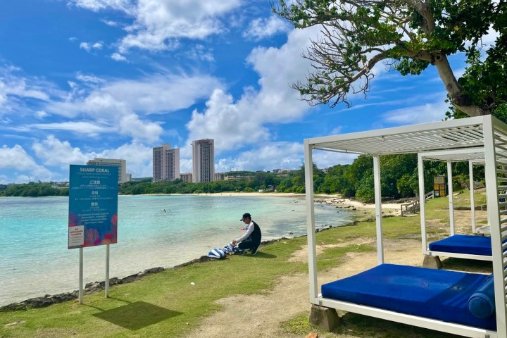 a bench next to a body of water