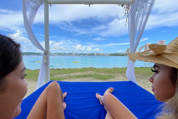 a person sitting in a boat on a body of water