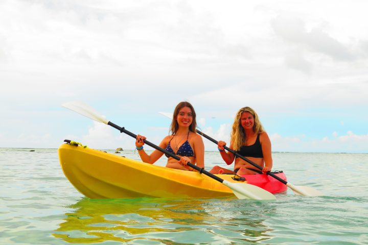 a person riding on the back of a boat in the water