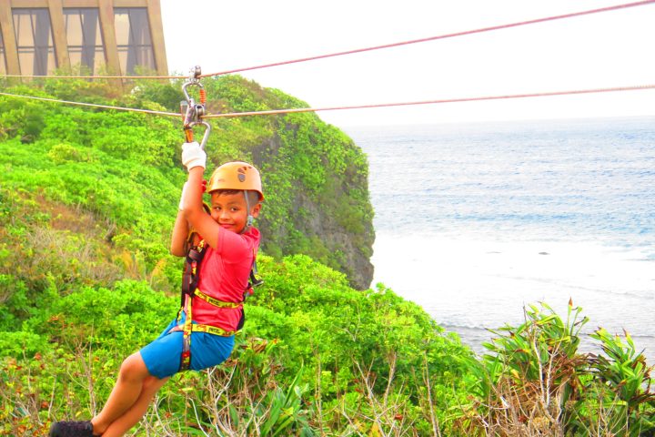 a person standing next to a body of water