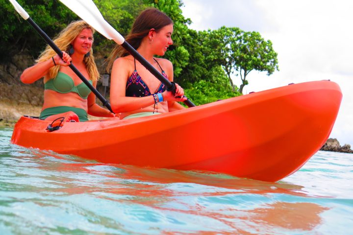 a person riding on the back of a boat