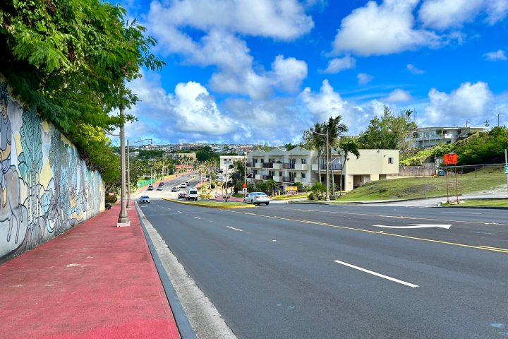 a street scene with focus on the side of a road