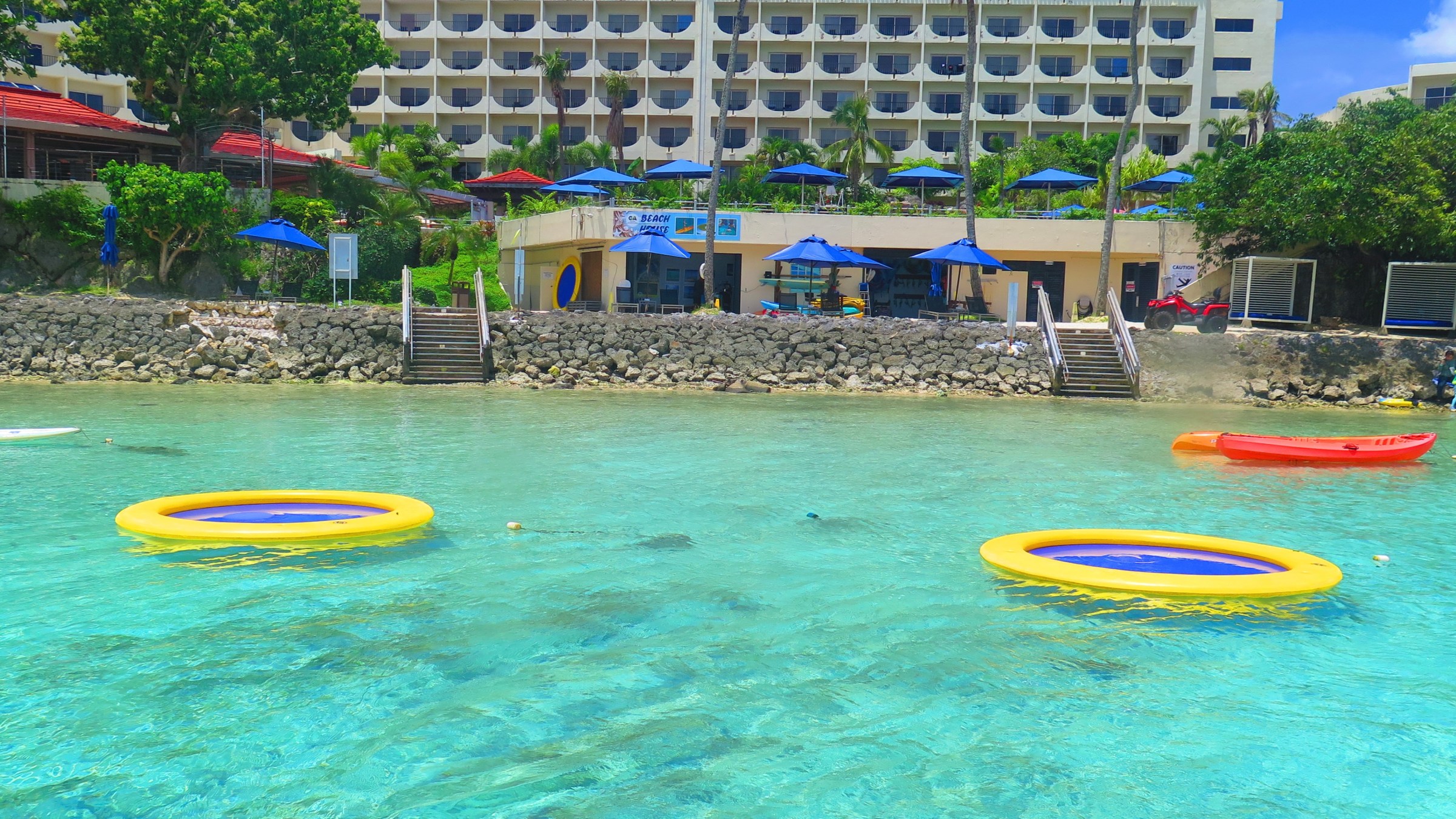 a group of lawn chairs sitting on top of a beach